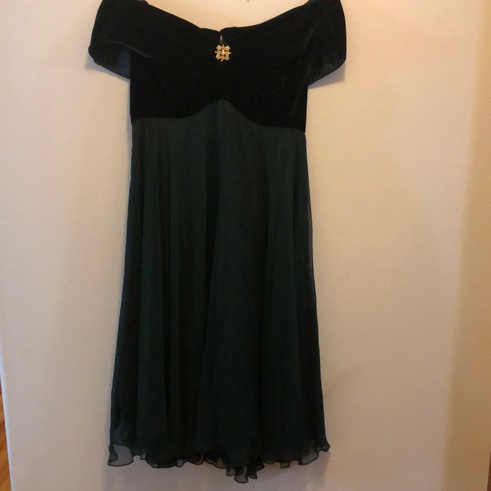 Dark green formal off the shoulder dress.